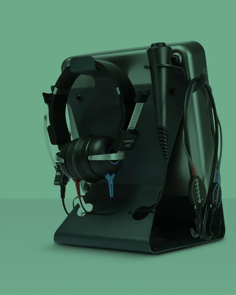 Affinity Compact version two resting in on-desk bracket alongside transducer and real-ear measurement headset.