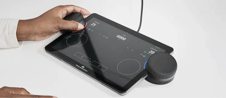 Close up of the Touch Keyboard displaying the pure tone audiometry screen. A clinician is using the left dial for the right ear