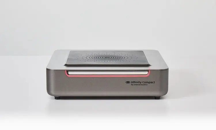 Version two of Affinity Compact. Speaker on its base. Red light on the front of the unit.