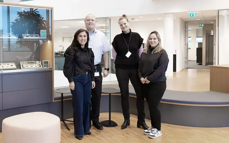 Interacoustics employees gathered in the office lobby at the company headquarters