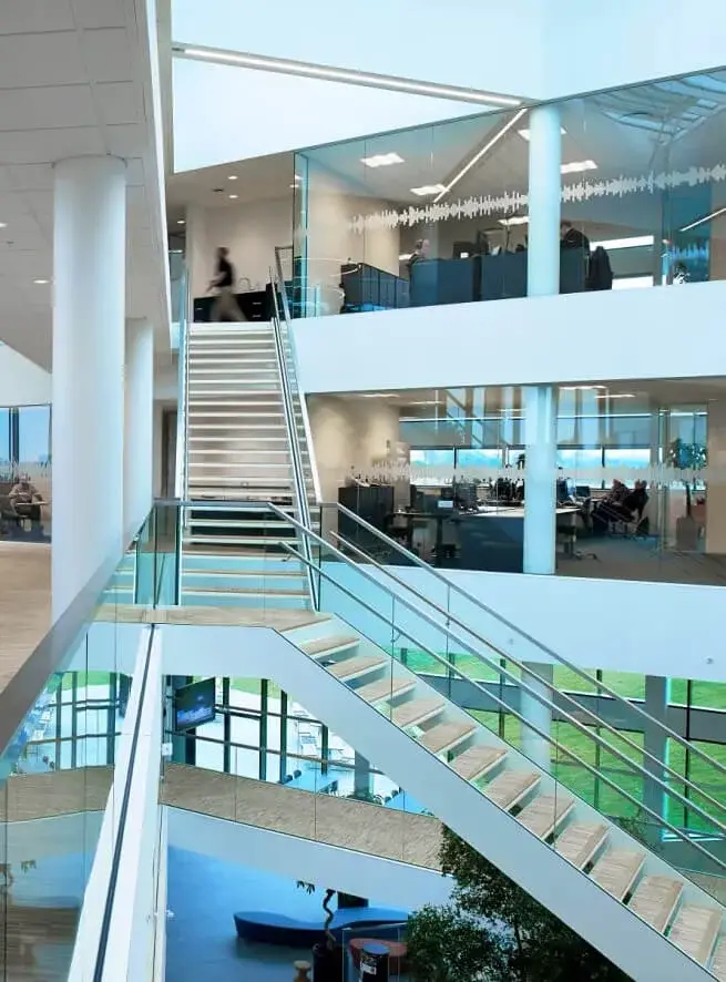 The open staircase and atrium inside the Interacoustics office