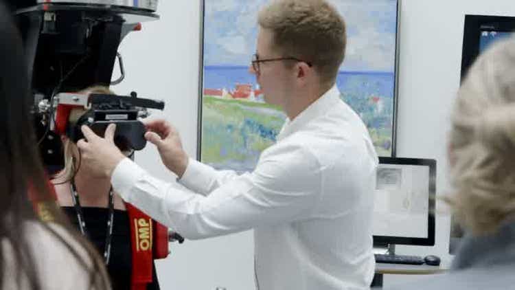 Interacoustics team member setting up video equipment in the office