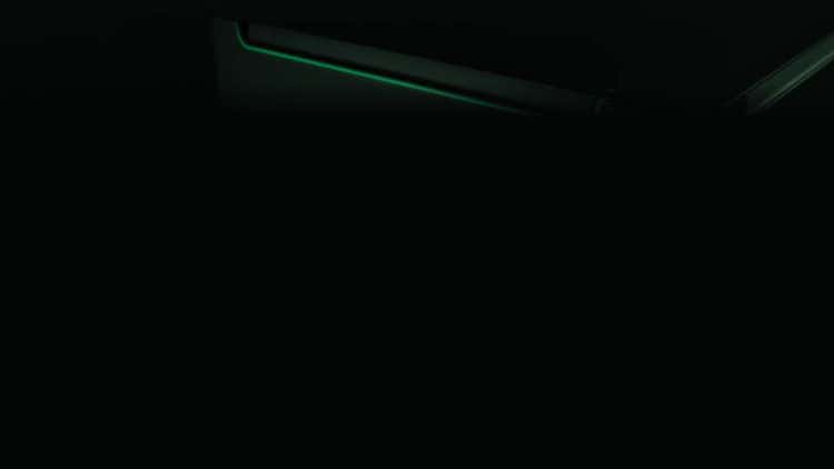 Equinox Evo audiometer detail lit by a green accent glow