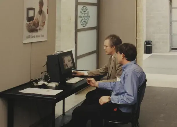 Archive photo of clinicians working at the PC-based MedPC test station