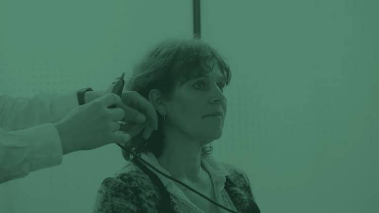 Clinician performing a hearing assessment with an ear probe