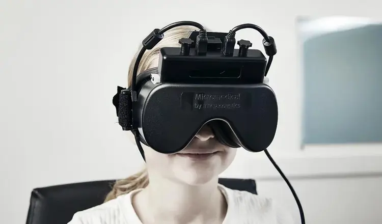Young girl wearing VNG goggles with top mounted cameras and start button